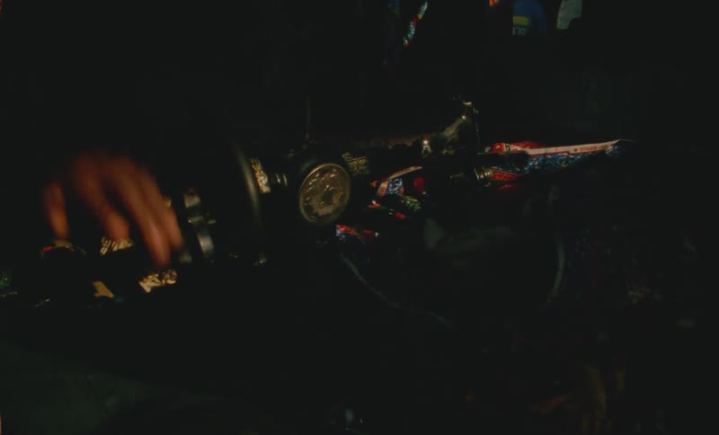 A man uses his hand to pedal a bicycle