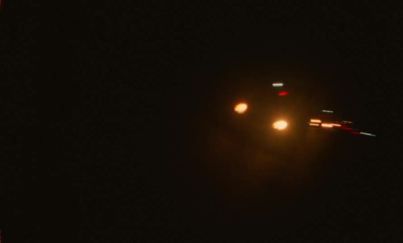 Nighttime city lights and headlights chaotic handheld movement