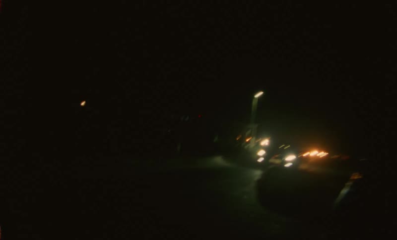 Cars are driving on a highway during the night time