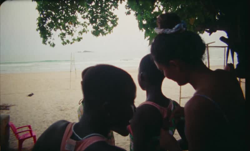 A group of friends are hanging out at the beach together