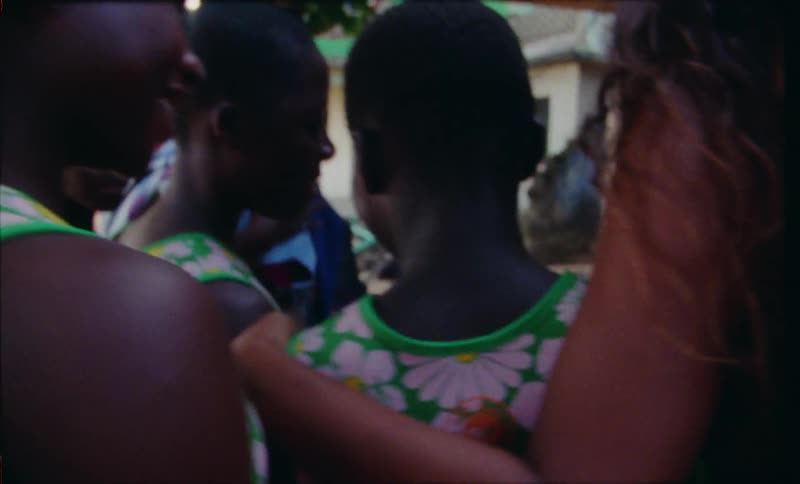 A group of people gathering in a celebration to take a portrait photo