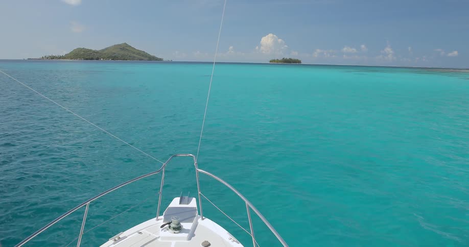 A boat is sailing in blue water