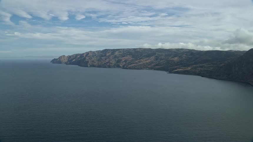 Aerial footage of Santa Catalina Islands coastline in Southern California captured during spring or summer shot using a Shotover F1 camera system showcasing the islands beauty on a partly cloudy day