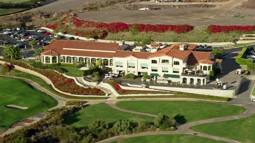 Aerial view of Trump National Golf Club clubhouse and golf course in Rancho Palos Verdes California on a partly cloudy day