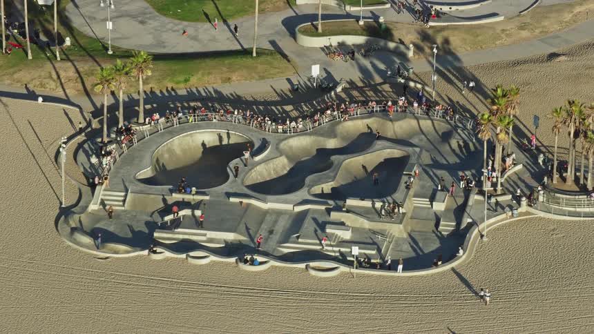 People skateboarding at Venice Skate Park on Venice Beach captured from a aerial view during a sunny day in Californias West Side