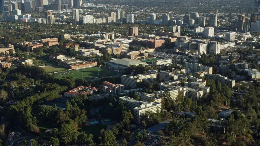 Aerial footage of the College campus in Los Angeles California during the summer showcasing recreation sports and relaxation activities among the students