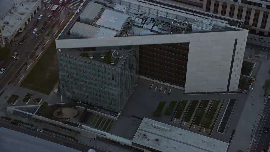 A stunning aerial shot of the LAPD headquarters in downtown LA during twilight