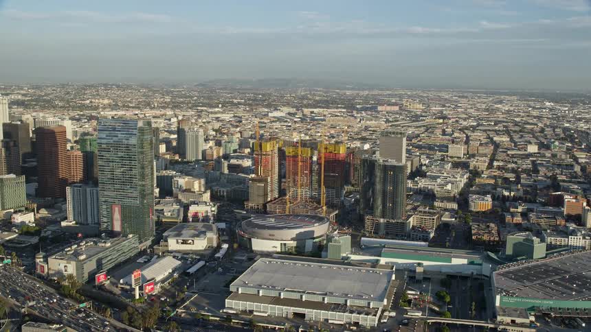 Aerial footage showcasing the Ritz-Carlton Hotel Staples Center and Oceanwide Plaza in Downtown Los Angeles during summertime