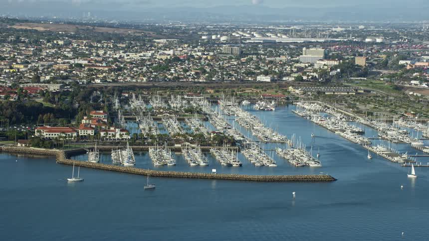 This is aerial footage of boats docked in San Pedros marina California during summertime