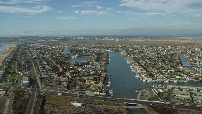 Approaching the residential community in Huntington Beach from an aerial shot with a wide angle view