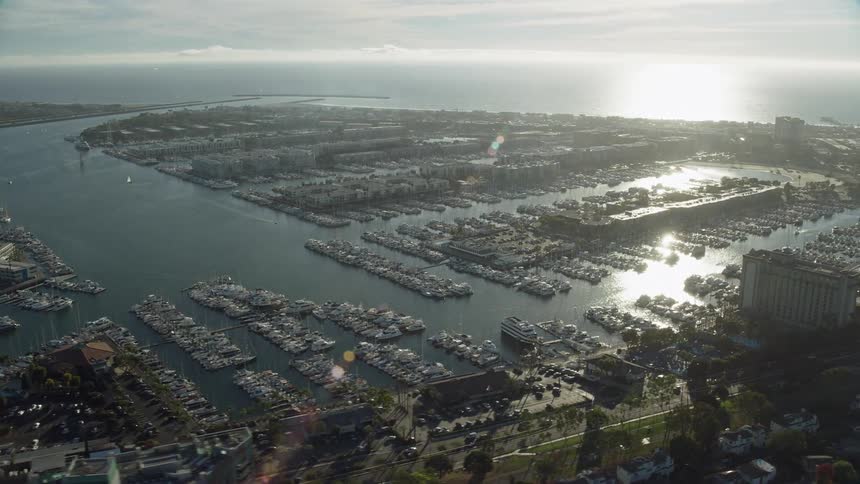An epic aerial view of boats at the marinas and waterfront apartment buildings in Marina Del Rey California during summertime