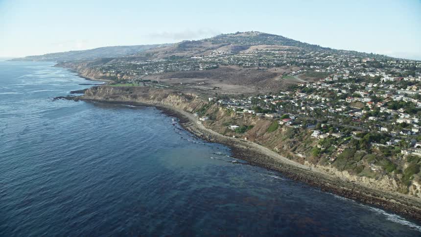 Aerial shot tilting from kelp to reveal San Pedros coastal cliffs and neighborhoods