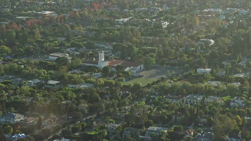 An epic aerial view of the Hawthorne School in Beverly Hills California during a hazy spring or summer day with stunning side views shot over by the Shotover F1 and Epic Helium cameras capturing the essence of learning and education in the southern Califo