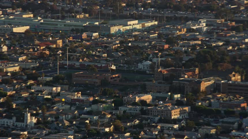 LAPD helicopter flies over Hollywood and Koreatown Los Angeles during daytime in this aerial stock footage