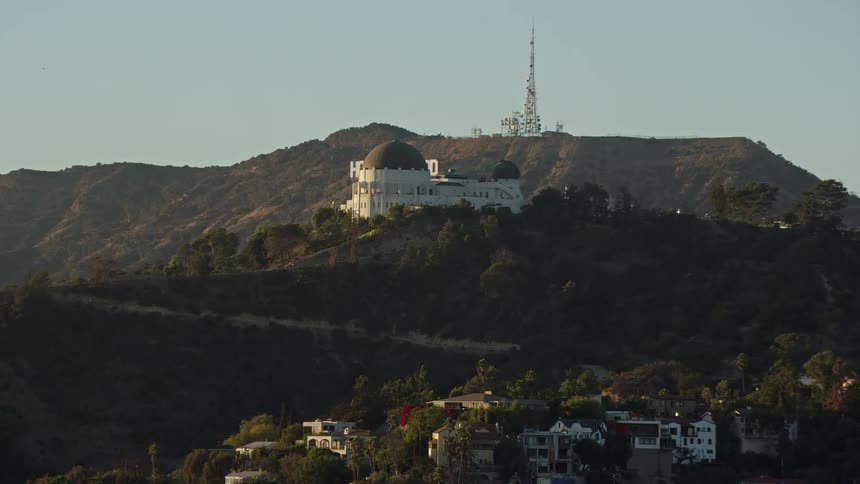 Aerial view of Griffith Observatory and Hollywood Sign in the background overlooking Los Angeles California