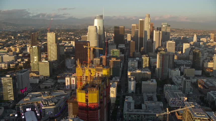 Aerial footage of Downtown Los Angeles skyscrapers at sunset seen from Oceanwide Plaza