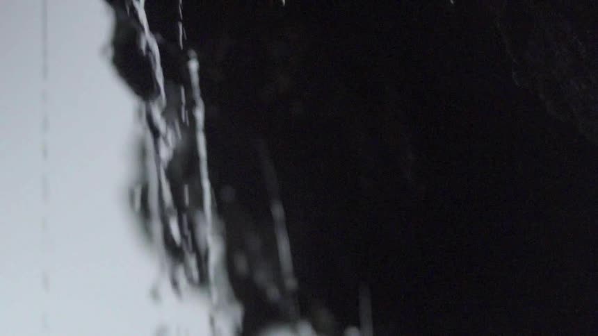 Water slowly drips from the rocks