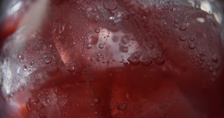 A view of a drink with bubbles in it