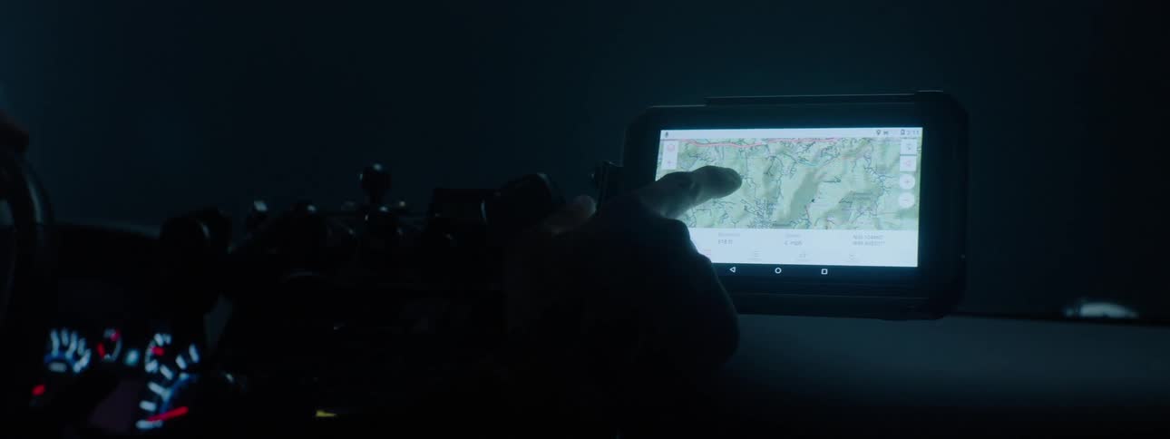 A man scrolls through his vehicles touch screen
