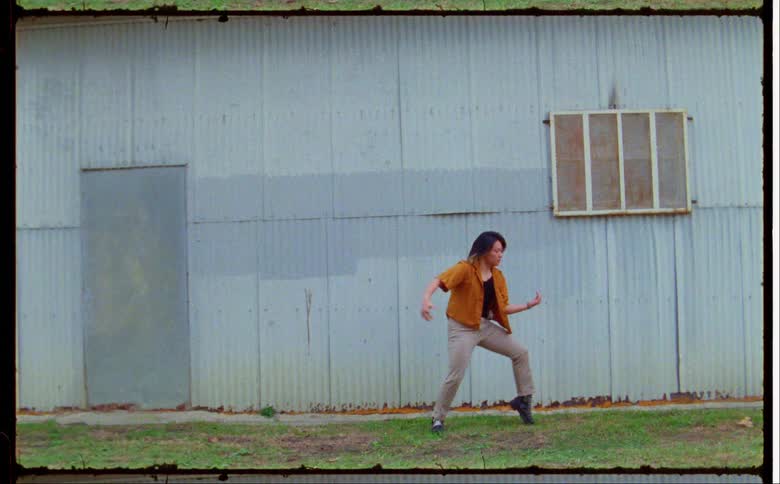 A woman is dancing outside