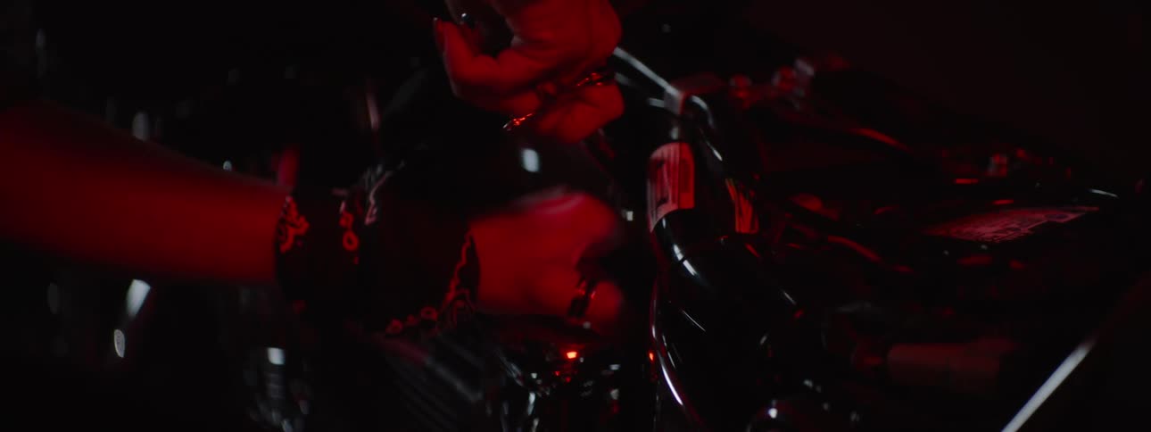 A person is repairing the motorcycle