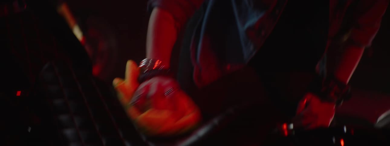 A woman is washing her motorcycle