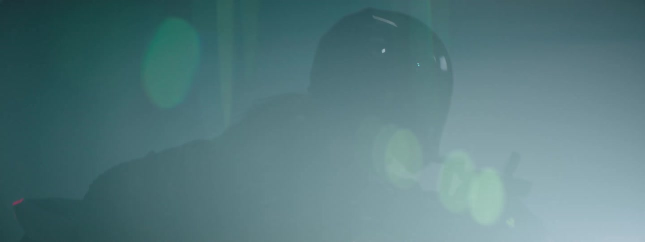 A person is riding a motorcycle during the night time