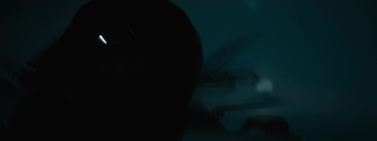 A female is riding her motorcycle during the night