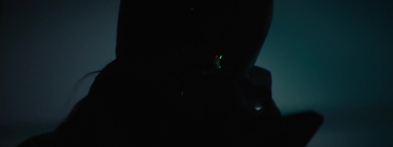 A close up of a person wearing a full face helmet riding a motorcycle