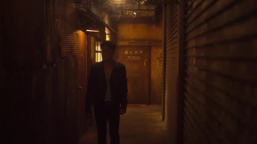 A man walks down the alley