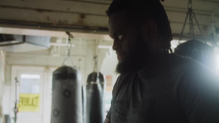 A man is lifting a dumbbell