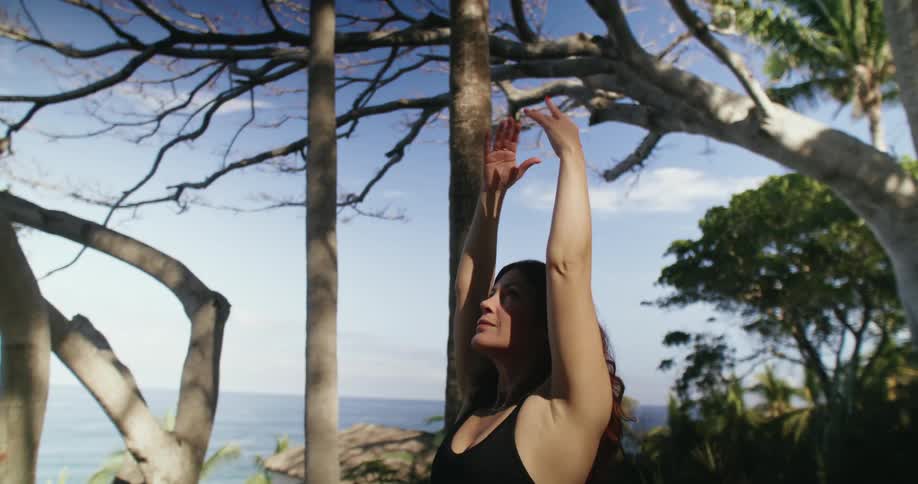 A woman is stretching outdoors during the spring time