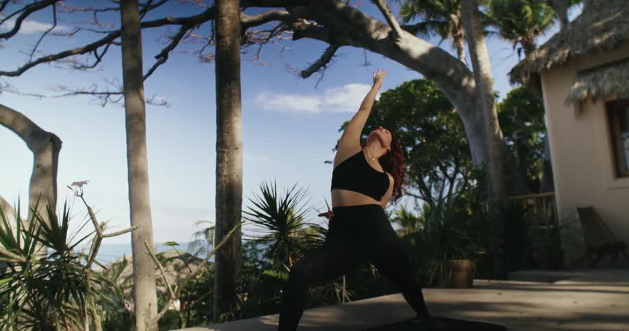 A woman is stretching outdoors during the spring