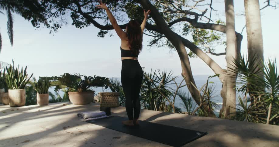 A woman is stretching outdoors during the spring time