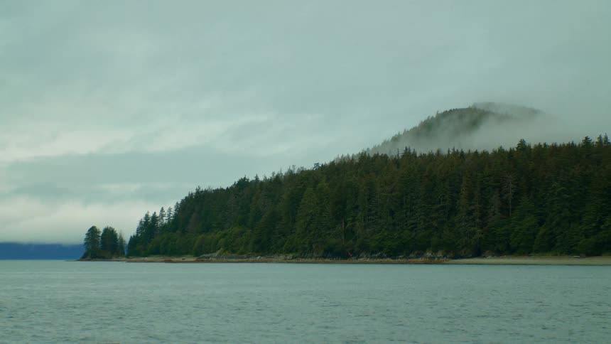 Landscape of lake and mountain forest on a cloudy day