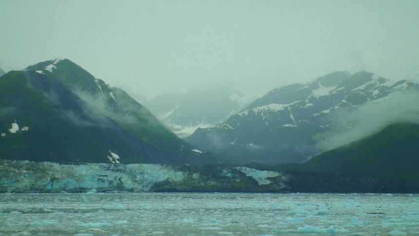 A body of water near the mountains is displayed