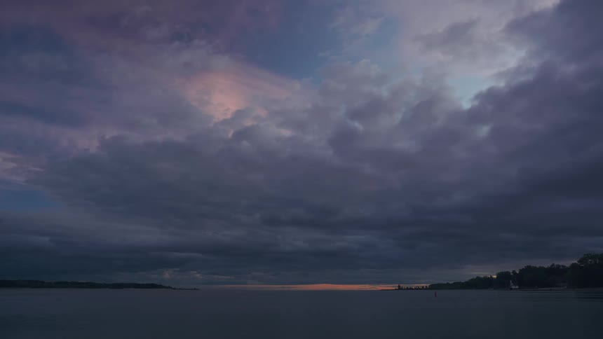 Landscape of sea and cloudy sky at dusk