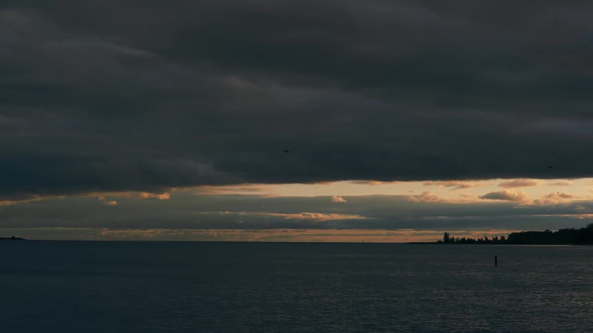 Landscape of sea and cloudy sky at dusk