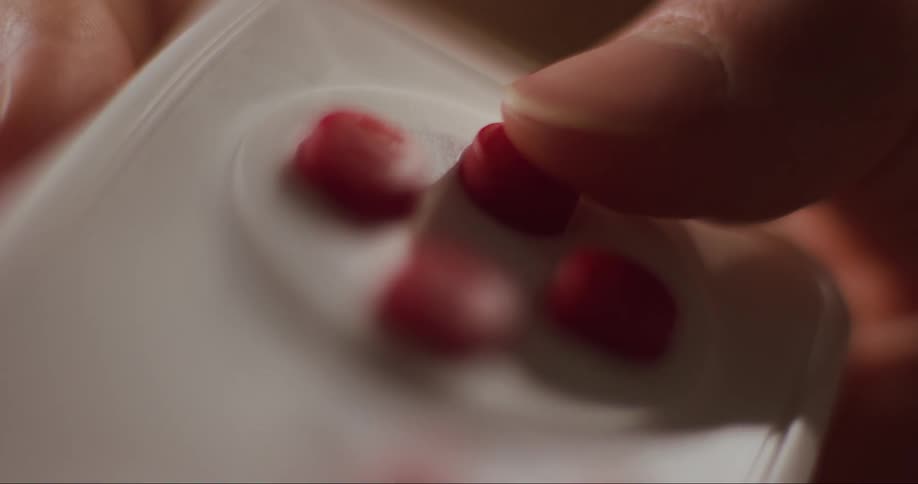 Close up of hand using video game controller