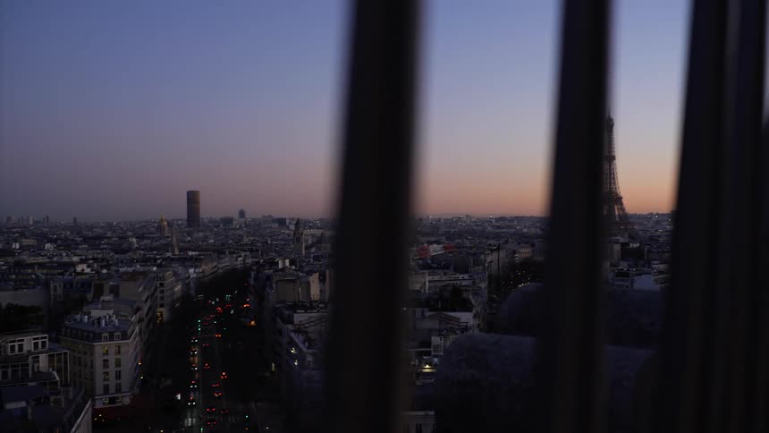Aerial view of a downtown city during dusk is displayed