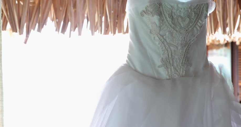 A white dress is hanging