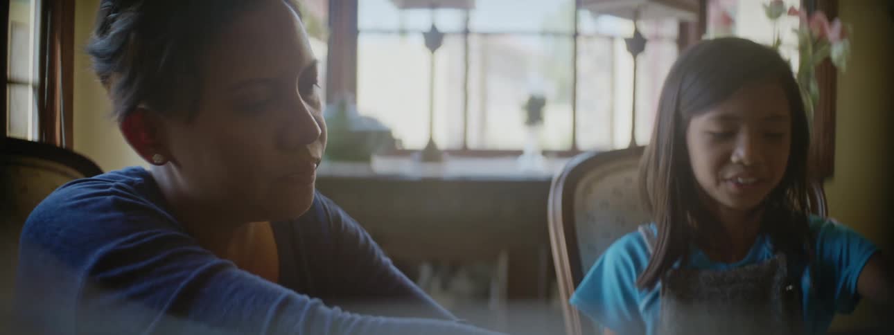 A mother and daughter are sitting and talking