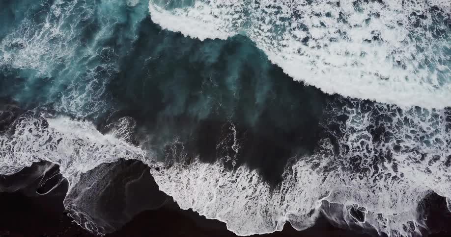The waves crash against the shore