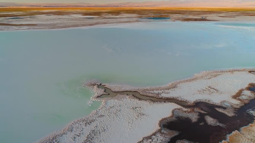 Aerial view of a salt lake in the desert at daytime