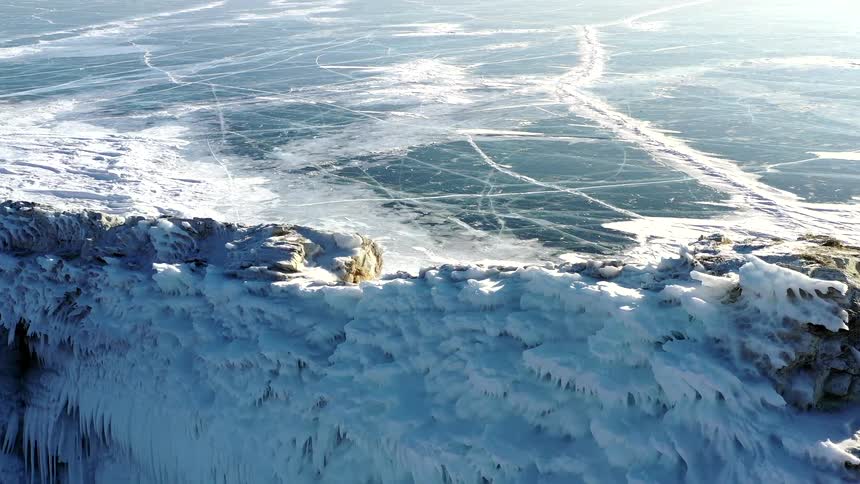 The water on the shore is frozen