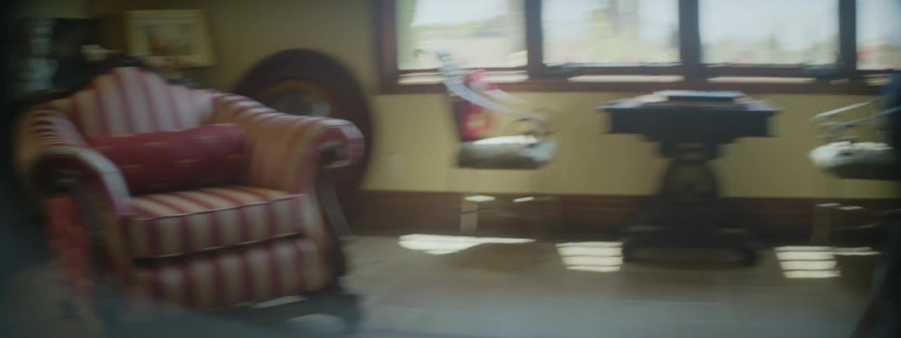 A mother and daughter throw a toy back and forth