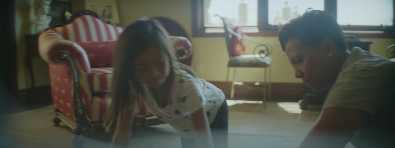 Child and mother are playing inside of there home