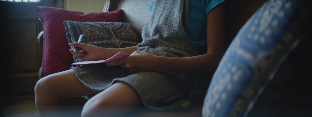 A child drawing on a piece of grow