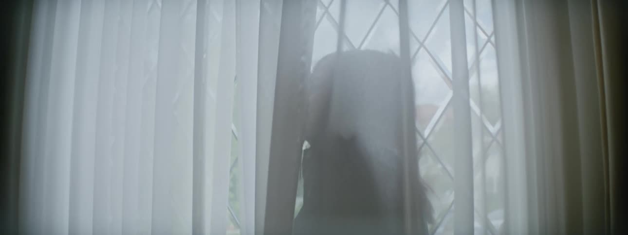 Daughter runs into room and hides behind filmy curtain before mother catches her