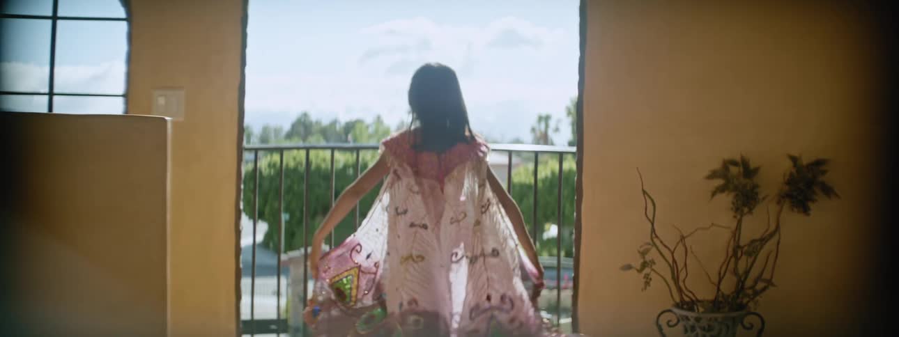 A girl playing with her a dress